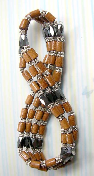 Shop for magnetic hematite jewelry online wholesale - multi light brown wood tubes and silver beads forming magnetic hematite necklace